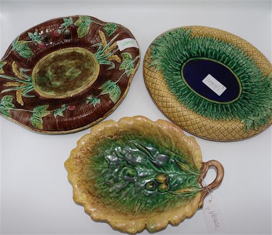 Two Majolica bread dishes and a leaf dish